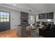 Inviting living room with stylish seating and a black painted brick fireplace at 129 Castle Dr, Smithfield, NC 27577