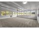 Bright sunroom with a wall of windows and carpet flooring at 129 Castle Dr, Smithfield, NC 27577