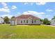 The back of this property has a big yard, trees and rear entrance at 1325 Sweetclover Dr, Wake Forest, NC 27587