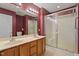 Full bathroom with double sinks and a glass-enclosed shower at 1325 Sweetclover Dr, Wake Forest, NC 27587