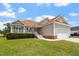 Charming single-Gathering home featuring manicured lawn, attractive landscaping and an attached two-car garage at 1325 Sweetclover Dr, Wake Forest, NC 27587
