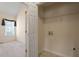 Small laundry area with storage and open doorway at 1325 Sweetclover Dr, Wake Forest, NC 27587