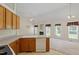 Open-concept kitchen and living room with fireplace and natural light at 1325 Sweetclover Dr, Wake Forest, NC 27587