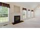 Inviting living room with fireplace, large windows, and neutral tones at 1325 Sweetclover Dr, Wake Forest, NC 27587