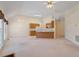 Open-concept living area showcasing kitchen, eat-in bar, and abundant natural light at 1325 Sweetclover Dr, Wake Forest, NC 27587