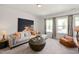 Comfortable bonus room with a large sectional sofa, bean bag and inviting decor at 134 Beacon Dr, Pittsboro, NC 27312