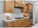 Well-equipped kitchen with a gas range, built-in microwave and oven, and ample counter space at 134 Beacon Dr, Pittsboro, NC 27312