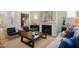 Cozy living room with a fireplace, stylish decor, and comfortable seating, perfect for relaxation at 134 Beacon Dr, Pittsboro, NC 27312