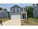 Charming two-story home with a two-car garage and classic curb appeal at 134 N Keatts Winner Ct, Wilson's Mills, NC 27520