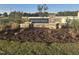 Landscaped community entrance with stone signage and well-manicured greenery, creating an inviting welcome at 134 N Keatts Winner Ct, Wilson's Mills, NC 27520