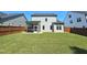 Expansive backyard with lush green lawn and privacy fence, perfect for outdoor activities at 1412 Queen Trigger Dr, Fuquay Varina, NC 27526