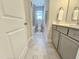 Well-lit bathroom features a vanity with storage, toilet, and shower-tub combination at 1412 Queen Trigger Dr, Fuquay Varina, NC 27526
