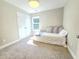 Bedroom with plush carpeting, one window, comfortable bed and closet for ample storage at 1412 Queen Trigger Dr, Fuquay Varina, NC 27526