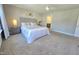 Comfortable main bedroom with a ceiling fan, carpet floors, and an ensuite bathroom at 1412 Queen Trigger Dr, Fuquay Varina, NC 27526