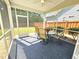 Relaxing screened-in porch with seating area and view of the backyard at 1412 Queen Trigger Dr, Fuquay Varina, NC 27526