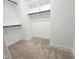 Spacious walk-in closet with built-in shelves and rod for ample storage at 1412 Queen Trigger Dr, Fuquay Varina, NC 27526
