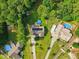 Aerial view featuring homes with swimming pools and lush green surroundings at 153 Hickory Nut Dr, Smithfield, NC 27577