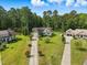 Aerial view of a charming home with long driveway and lush green surroundings at 153 Hickory Nut Dr, Smithfield, NC 27577