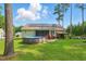 Expansive backyard with above-ground pool, solar panels, screened porch, and a covered patio at 153 Hickory Nut Dr, Smithfield, NC 27577