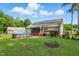 Large backyard features an above-ground pool, screened porch, covered patio, and fire pit at 153 Hickory Nut Dr, Smithfield, NC 27577