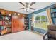 Bedroom featuring custom built-ins for storage and a large window with a backyard view at 153 Hickory Nut Dr, Smithfield, NC 27577