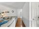 Bright, open-concept living room with wood floors, light blue walls and a comfortable sectional sofa at 153 Hickory Nut Dr, Smithfield, NC 27577