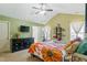 Spacious main bedroom featuring a vaulted ceiling, large bed, and a dark dresser at 153 Hickory Nut Dr, Smithfield, NC 27577