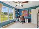 Office space with neutral carpeting, natural light, ceiling fan, and built-in storage at 153 Hickory Nut Dr, Smithfield, NC 27577