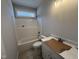 Bathroom featuring a shower/tub combo and vanity at 165 Tee Dr, Selma, NC 27576