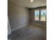 Bedroom with a window providing natural light and a view of the exterior at 165 Tee Dr, Selma, NC 27576