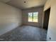 Bedroom with large window that provides great natural light, a perfect space for relaxation and rest at 183 Tee Dr, Selma, NC 27576