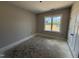 An unfinished bedroom with window allowing natural light at 183 Tee Dr, Selma, NC 27576