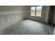 Unfinished bedroom featuring a window offering natural light and a view at 183 Tee Dr, Selma, NC 27576
