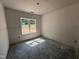 Bright bedroom with a large window offering abundant natural light and ready for personalization at 183 Tee Dr, Selma, NC 27576