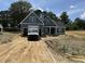 Charming, new construction home featuring a two car garage and covered front porch in a quiet neighborhood at 183 Tee Dr, Selma, NC 27576