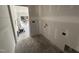 Unfinished laundry room with washer and dryer hookups, offering customization options at 183 Tee Dr, Selma, NC 27576