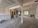 Spacious living room under construction with an open floor plan and views into the kitchen at 183 Tee Dr, Selma, NC 27576