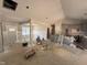 Bright open-concept living space featuring wainscoting details and a seamless transition into the adjacent kitchen area at 183 Tee Dr, Selma, NC 27576