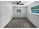 A bright bedroom features fresh paint, carpet, ceiling fan, and natural light at 1914 Adams Pl, Hillsborough, NC 27278