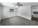 Well-lit bedroom with a ceiling fan, neutral walls, and carpeted flooring, ready for personalization at 1914 Adams Pl, Hillsborough, NC 27278