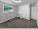 View of a bedroom with neutral walls, carpeted floors, closet, and a window for natural light at 1914 Adams Pl, Hillsborough, NC 27278
