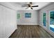 View of dining area with hardwood floors, natural light, access to the deck, and a closet at 1914 Adams Pl, Hillsborough, NC 27278