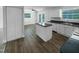 Open kitchen includes stainless appliances, an island, lots of light, and a dining area at 1914 Adams Pl, Hillsborough, NC 27278