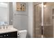 Modern bathroom featuring a glass-enclosed shower and a stylish vanity at 205 Silent Cove Ln, Holly Springs, NC 27540