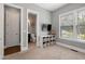 Cozy bedroom with a mounted TV, a storage console, and an adjacent bathroom at 205 Silent Cove Ln, Holly Springs, NC 27540