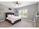 Cozy bedroom features a comfortable bed, natural lighting, and neutral color palette at 205 Silent Cove Ln, Holly Springs, NC 27540