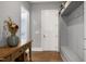 Inviting entryway featuring a rustic wooden console table and custom mudroom storage at 205 Silent Cove Ln, Holly Springs, NC 27540