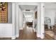 Inviting hallway with hardwood floors and elegant décor, creating a warm and welcoming atmosphere at 205 Silent Cove Ln, Holly Springs, NC 27540