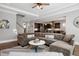 Comfortable living area with hardwood floors and an open layout into the kitchen at 205 Silent Cove Ln, Holly Springs, NC 27540