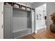 Custom mudroom area with built-in storage, bench seating, and coat hooks at 205 Silent Cove Ln, Holly Springs, NC 27540